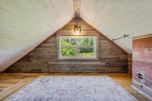 W1511 County Rd Hh, Fremont, WI 54940 - additional living space featuring wooden walls, lofted ceiling, and wood-type flooring