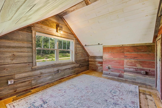 W1511 County Rd Hh, Fremont, WI 54940 - bonus room featuring wood walls, vaulted ceiling, and wood-type flooring