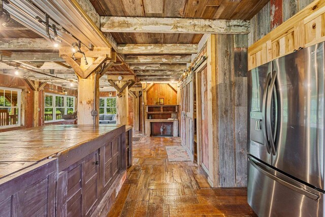 W1511 County Rd Hh, Fremont, WI 54940 - kitchen with stainless steel fridge with ice dispenser, dark wood-style flooring, a wood ceiling with exposed beams, and wood counters