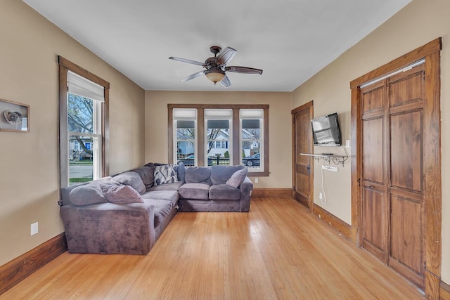 1235 Grove Ave, Racine, WI 53405 - living room with ceiling fan and light wood-style floors