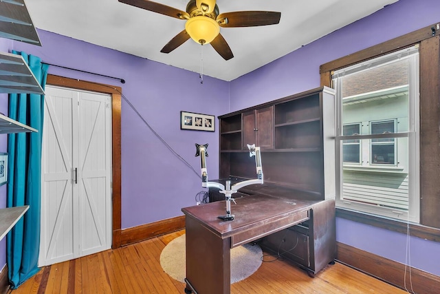 1235 Grove Ave, Racine, WI 53405 - home office with light wood-style floors and ceiling fan