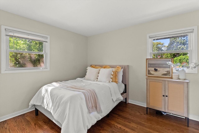5717 S 42nd St, Greenfield, WI 53221 - bedroom featuring multiple windows and dark wood-style floors