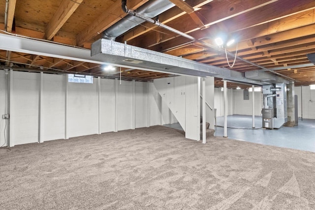 5717 S 42nd St, Greenfield, WI 53221 - basement with heating unit, stairs, and carpet floors