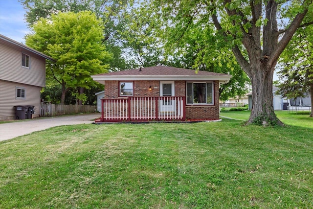 5717 S 42nd St, Greenfield, WI 53221 - view of front facade with brick siding and a deck