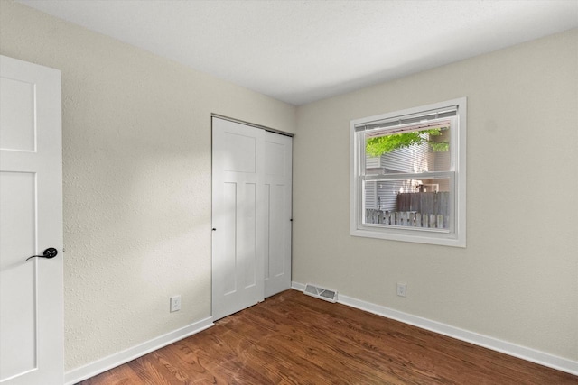 5717 S 42nd St, Greenfield, WI 53221 - unfurnished bedroom featuring wood finished floors and a closet