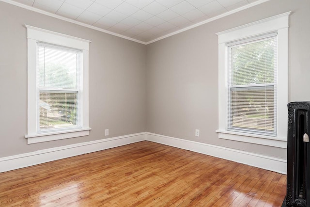 716 Vernon Ave, Beloit, WI 53511 - empty room featuring hardwood / wood-style flooring and crown molding