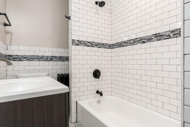 716 Vernon Ave, Beloit, WI 53511 - bathroom featuring  shower combination, tile walls, and vanity