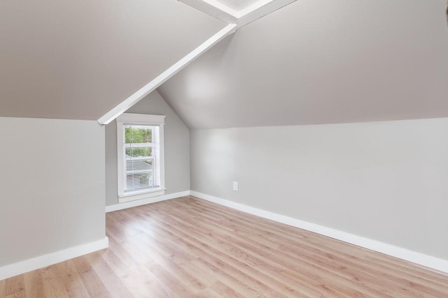 716 Vernon Ave, Beloit, WI 53511 - additional living space with light wood finished floors and vaulted ceiling