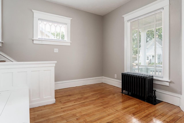 716 Vernon Ave, Beloit, WI 53511 - empty room featuring radiator and light wood-style floors