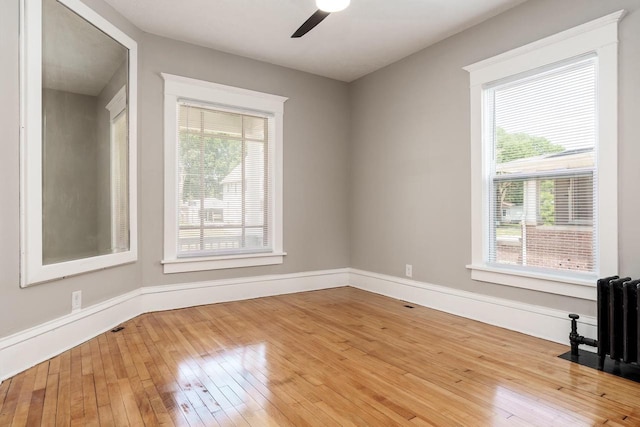 716 Vernon Ave, Beloit, WI 53511 - spare room with a ceiling fan, wood-type flooring, and plenty of natural light