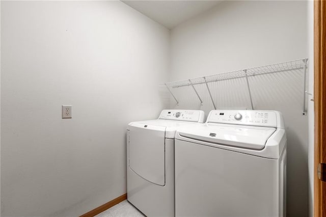 1163 Pine Acre Ln, Chippewa Falls, WI 54729 - laundry room featuring washer and clothes dryer and baseboards