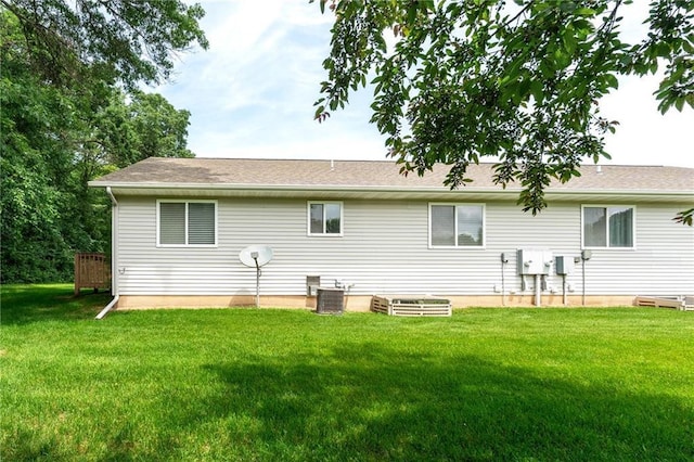 1163 Pine Acre Ln, Chippewa Falls, WI 54729 - back of house with a yard and a shingled roof
