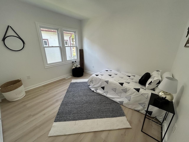 3041 N 52nd St, Milwaukee, WI 53210 - bedroom with light wood-type flooring and baseboards