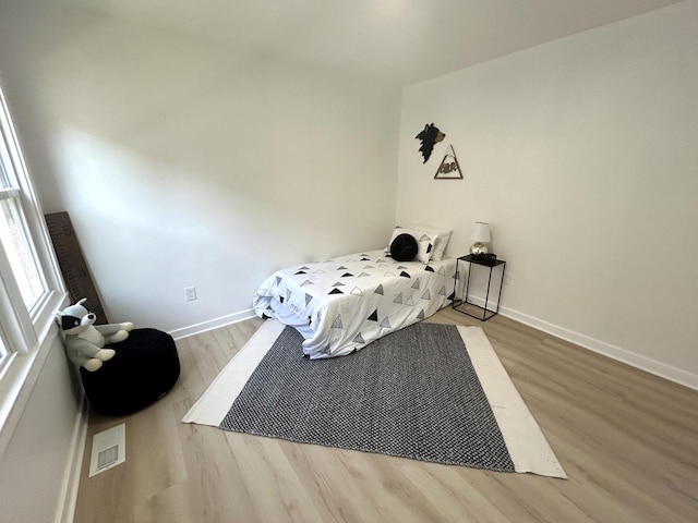3041 N 52nd St, Milwaukee, WI 53210 - bedroom featuring wood finished floors and baseboards