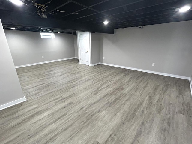 3041 N 52nd St, Milwaukee, WI 53210 - below grade area with baseboards and wood finished floors