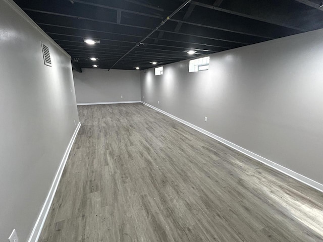 3041 N 52nd St, Milwaukee, WI 53210 - below grade area featuring baseboards and wood finished floors