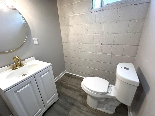 3041 N 52nd St, Milwaukee, WI 53210 - bathroom with vanity, concrete block wall, and wood finished floors