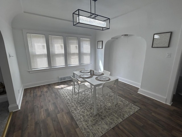 3041 N 52nd St, Milwaukee, WI 53210 - dining space featuring arched walkways and dark wood-style floors