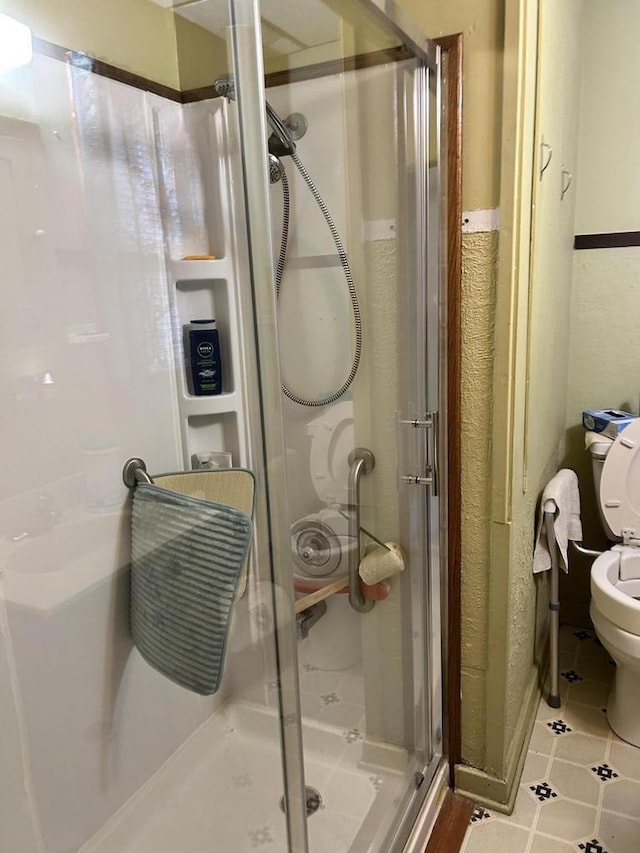 512 Division St, Stoddard, WI 54658 - bathroom with a shower stall and tile patterned flooring