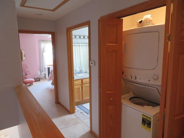 306 N Sales St Unit # 1, Merrill, WI 54452 - laundry area with estacked washer and dryer and light colored carpet