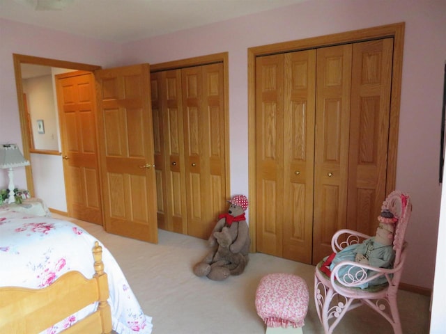 306 N Sales St Unit # 1, Merrill, WI 54452 - carpeted bedroom featuring multiple closets