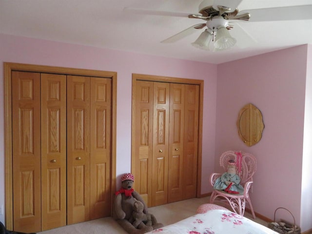 306 N Sales St Unit # 1, Merrill, WI 54452 - bedroom with multiple closets, carpet floors, and a ceiling fan