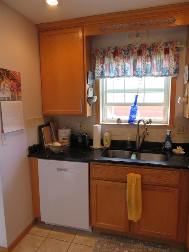 306 N Sales St Unit # 1, Merrill, WI 54452 - kitchen featuring white dishwasher, decorative backsplash, dark countertops, light tile patterned floors, and recessed lighting