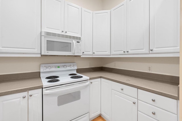 530 W Doty St Unit 107, Madison, WI 53703 - kitchen featuring white appliances and white cabinetry