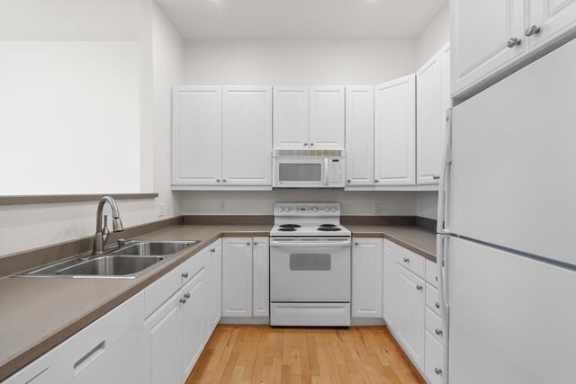 530 W Doty St Unit 107, Madison, WI 53703 - kitchen featuring white appliances, white cabinetry, light wood-style flooring, and recessed lighting