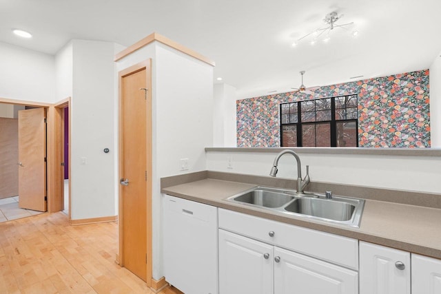 530 W Doty St Unit 107, Madison, WI 53703 - kitchen featuring white dishwasher, white cabinetry, light wood-type flooring, and recessed lighting