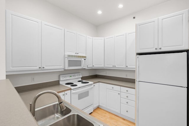 530 W Doty St Unit 107, Madison, WI 53703 - kitchen featuring white appliances, recessed lighting, white cabinetry, and light wood-style flooring