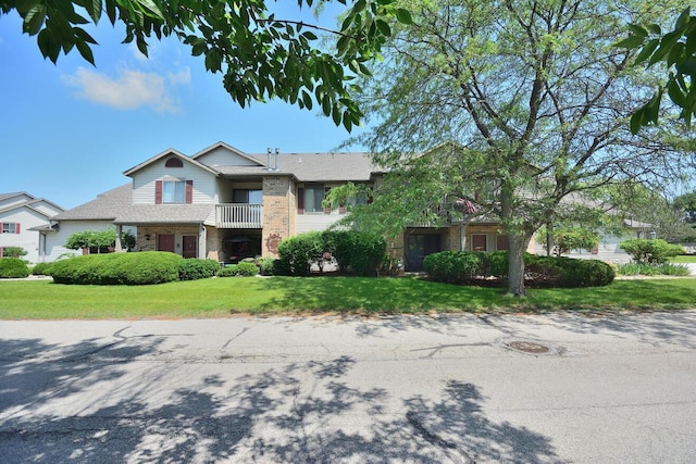 W192S7850 Overlook Bay Rd Unit 3, Muskego, WI 53150 - view of front of house with brick siding and a front lawn