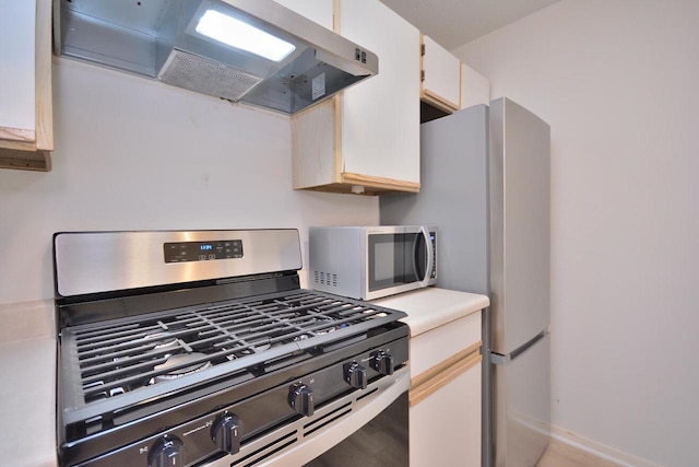 W192S7850 Overlook Bay Rd Unit 3, Muskego, WI 53150 - kitchen featuring appliances with stainless steel finishes, extractor fan, light countertops, and white cabinets