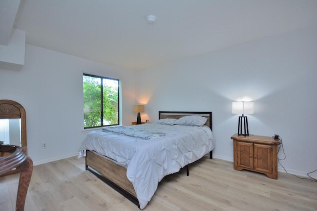 W192S7850 Overlook Bay Rd Unit 3, Muskego, WI 53150 - bedroom with light wood-style floors and baseboards