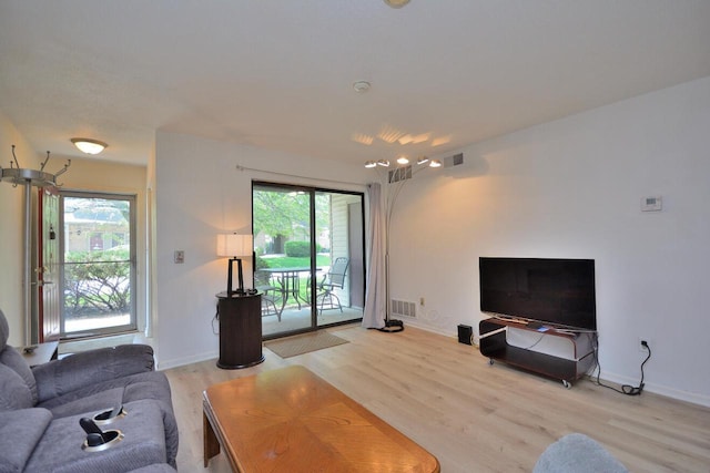 W192S7850 Overlook Bay Rd Unit 3, Muskego, WI 53150 - living area featuring light wood-style flooring and baseboards