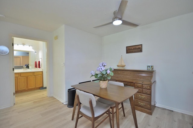 W192S7850 Overlook Bay Rd Unit 3, Muskego, WI 53150 - dining area with light wood-style flooring and a ceiling fan