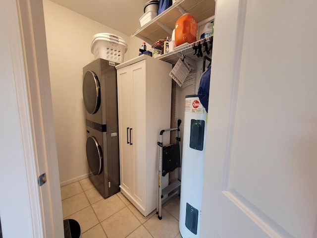 N113W16241 Sylvan Cir Unit 110, Germantown, WI 53022 - washroom with stacked washer / drying machine, light tile patterned flooring, and water heater