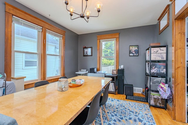 1756 Church St, Stevens Point, WI 54481 - dining room featuring a chandelier and light wood-style flooring