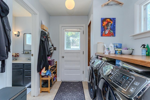 1756 Church St, Stevens Point, WI 54481 - washroom with washer and dryer, plenty of natural light, and light tile patterned flooring