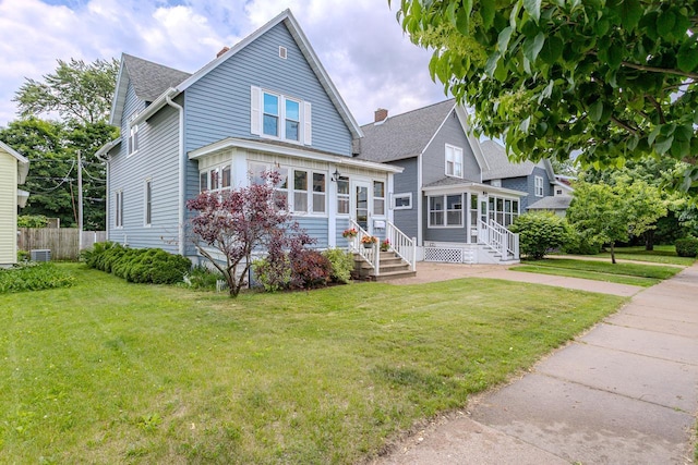 1756 Church St, Stevens Point, WI 54481 - view of front of house with entry steps, roof with shingles, and a sunroom