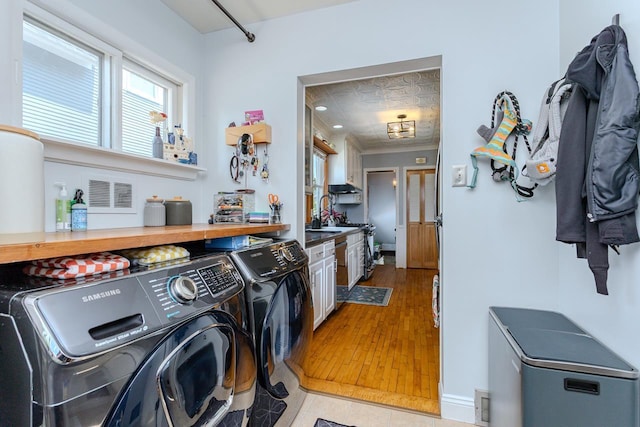 1756 Church St, Stevens Point, WI 54481 - laundry room featuring separate washer and dryer and light wood-type flooring