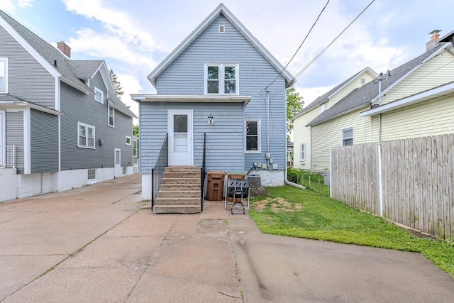 1756 Church St, Stevens Point, WI 54481 - back of property featuring entry steps and a patio area
