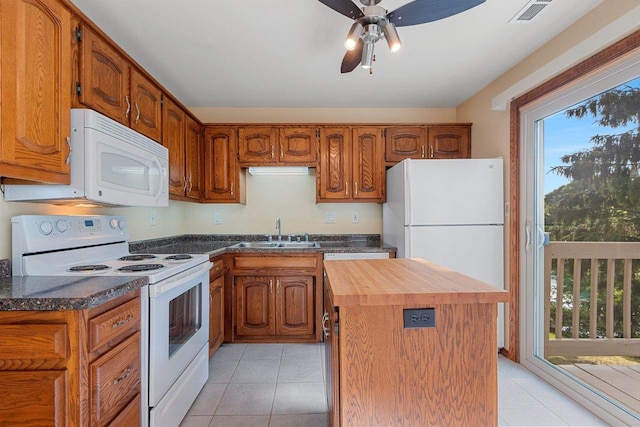 1820 Ridgeway Dr Unit 12A, De Pere, WI 54115 - kitchen with white appliances, healthy amount of natural light, light tile patterned floors, and wooden counters