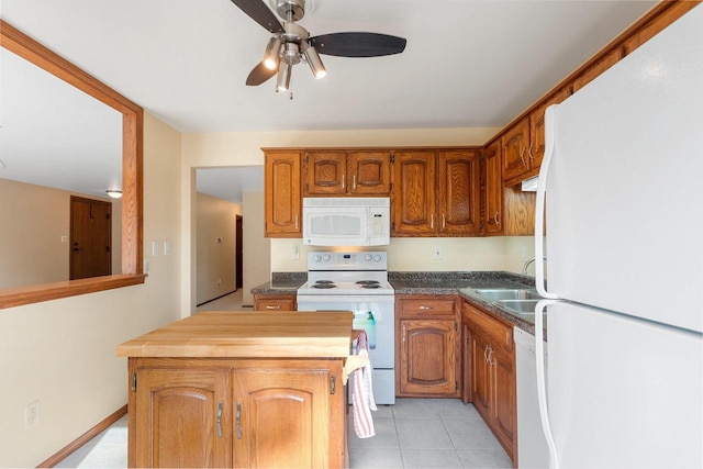 1820 Ridgeway Dr Unit 12A, De Pere, WI 54115 - kitchen with white appliances, a center island, butcher block counters, light tile patterned flooring, and ceiling fan