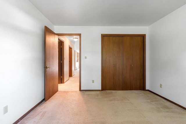 1820 Ridgeway Dr Unit 12A, De Pere, WI 54115 - unfurnished bedroom featuring light colored carpet and a closet