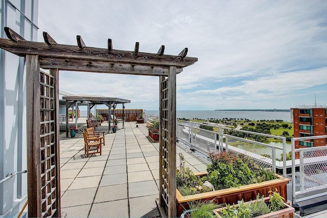 1610 N Prospect Ave Unit 1104, Milwaukee, WI 53202 - view of patio featuring a water view