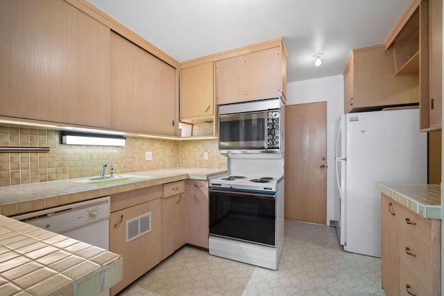 1610 N Prospect Ave Unit 1104, Milwaukee, WI 53202 - kitchen featuring white appliances, light brown cabinets, light flooring, open shelves, and backsplash