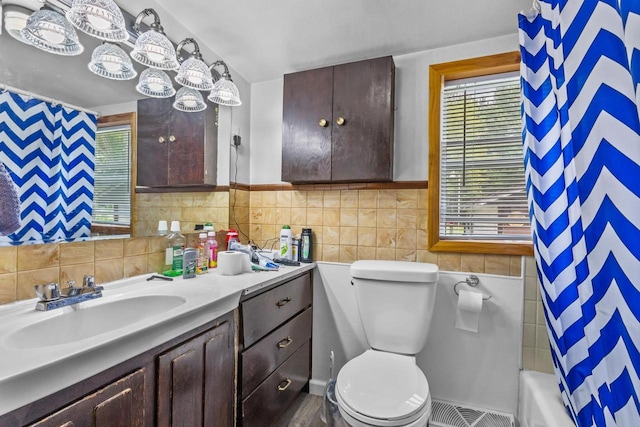 W914 Madsen Rd, Marinette, WI 54143 - full bath with tile walls, vanity, and shower / tub combo