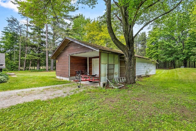 W914 Madsen Rd, Marinette, WI 54143 - view of home's exterior featuring a yard and an outbuilding