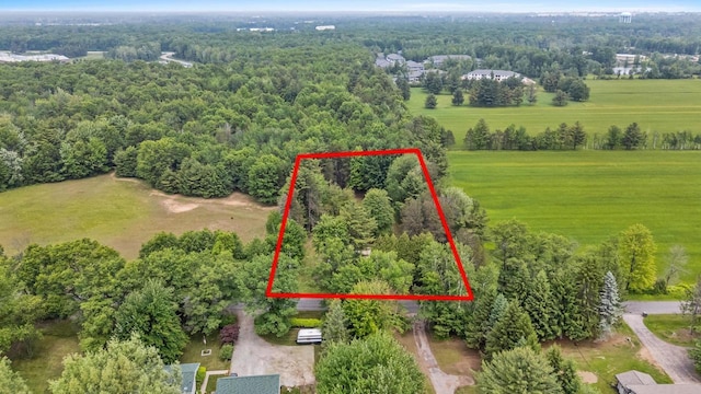 W914 Madsen Rd, Marinette, WI 54143 - aerial view of property's location featuring property boundaries highlighted and a heavily wooded area